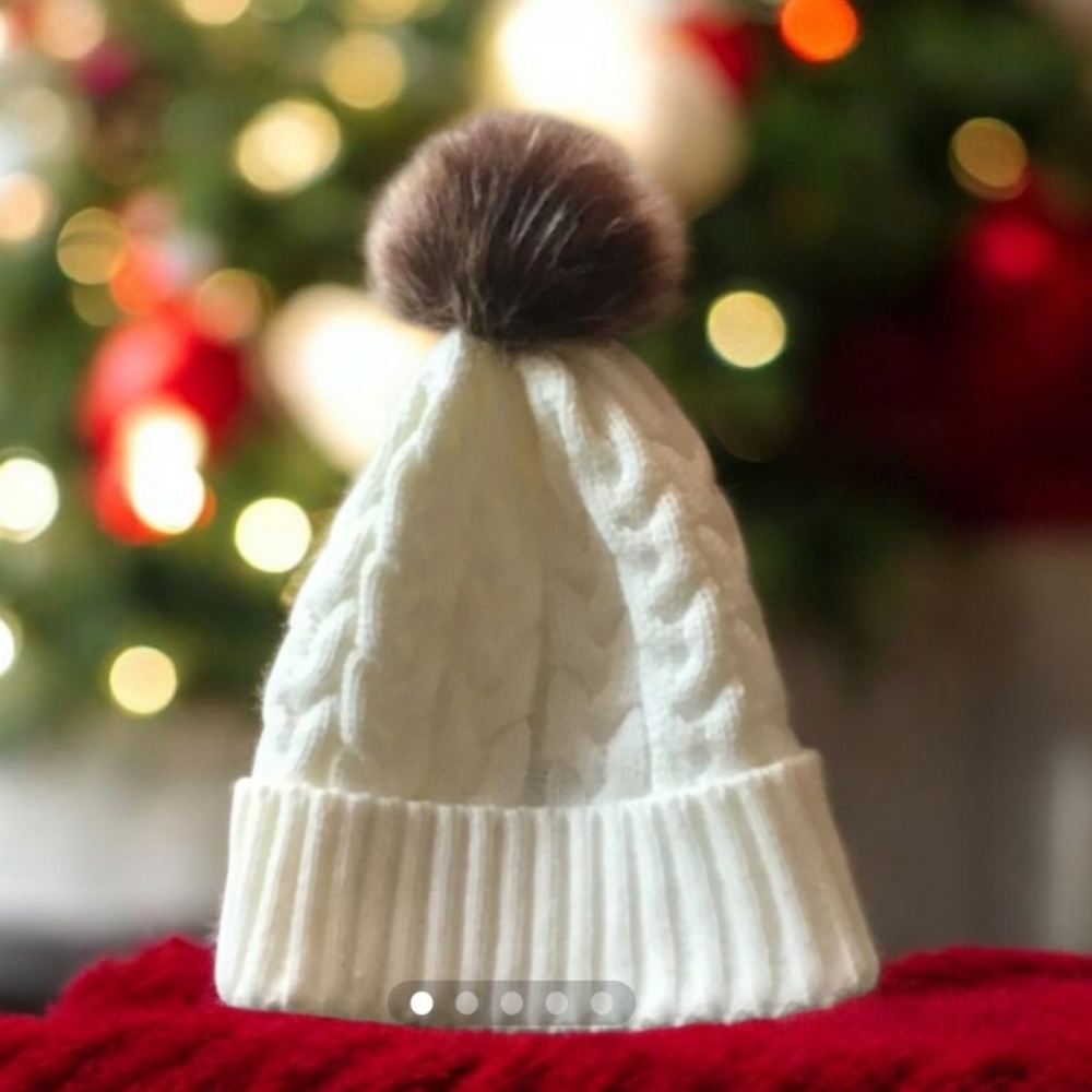 Winter hat knit off white Pom Pom brown one size fits all. Nice stitches…